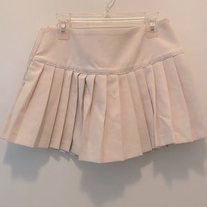 Pleated skirt with shorts.